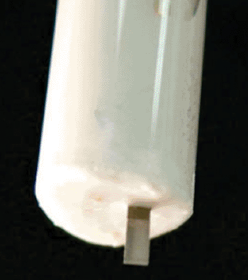Image:	Tiny piezoelectric cantilever sensors, similar to the one pictured here, are being calibrated by Drexel engineers to detect DNA (Photo courtesy of Drexel University).